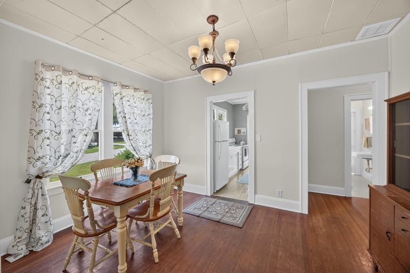 Dining room with table, chairs, and chandelier at 101 N Lake St, Crescent City, FL