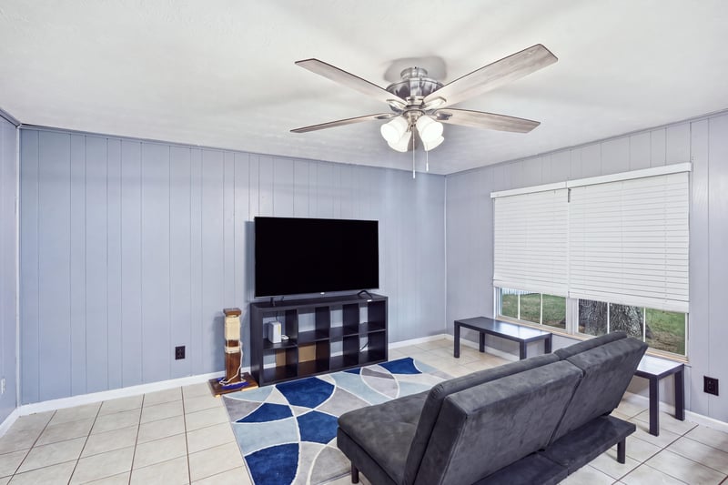 Living room with TV stand and area rug at 417 Capricorn Ln, Orange Park, FL 32073