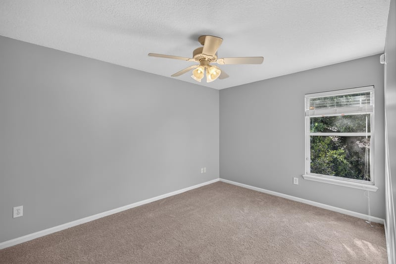 Empty bedroom with carpet and window at 470 Sparrow Branch Cir, Jacksonville, FL 32259