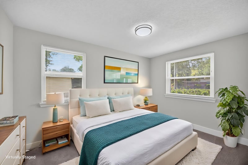 Bedroom with staged bed and nightstand at 6238 Randia Dr, Jacksonville, FL 32210
