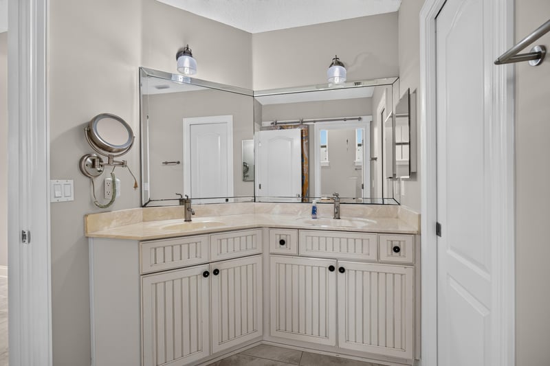 Bathroom vanity with mirror at 117 Island Cottage Way, St. Augustine, FL 32080