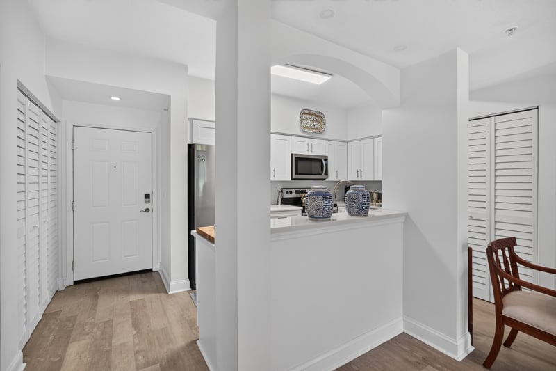 Hallway with closet doors and wood flooring at 10435 Mid Town Pkwy unit 135, Jacksonville, FL 32246