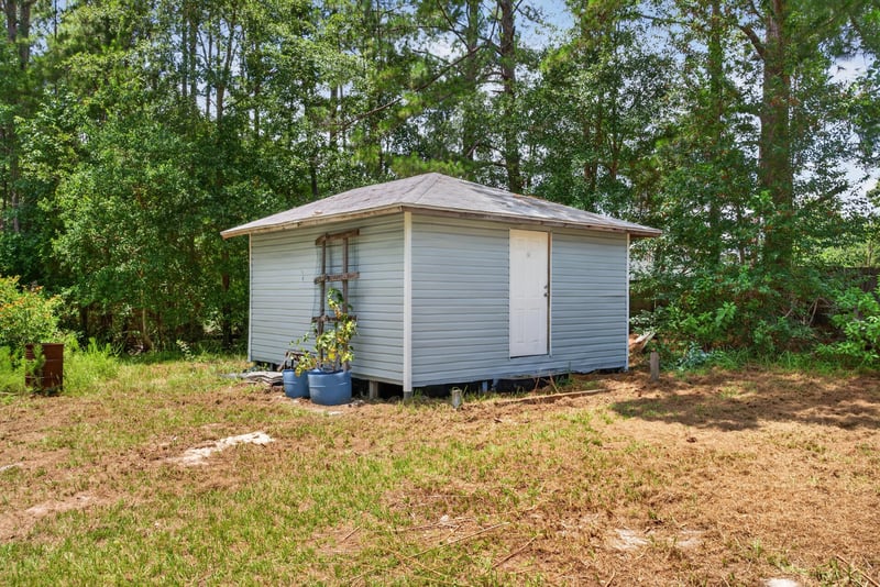 Small white shed building on the property at 4890 McAllister Rd, Middleburg, FL 32068