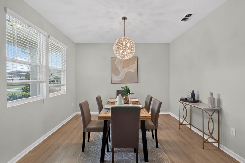 Dining room with table, chairs and area rug at 6830 Hanford St, Jacksonville, FL 32219