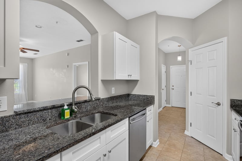 Kitchen pass-through counter with dishwasher at 7990 Baymeadows Rd E #404, Jacksonville, FL 32256