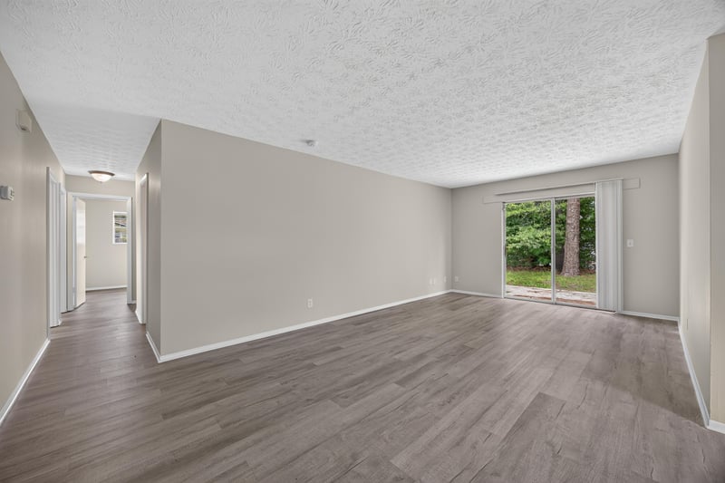 Hallway view toward living room and sliding glass door at 1083 Stokes St, Jacksonville, FL