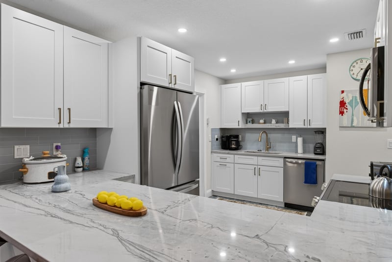 Kitchen with granite counters and built-in microwave at 1525 8th St N, Jacksonville Beach, FL