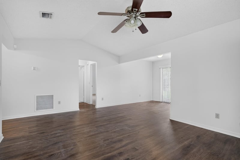 Living room with wood-look flooring at 1445 Classic Oak Rd W, Jacksonville, FL