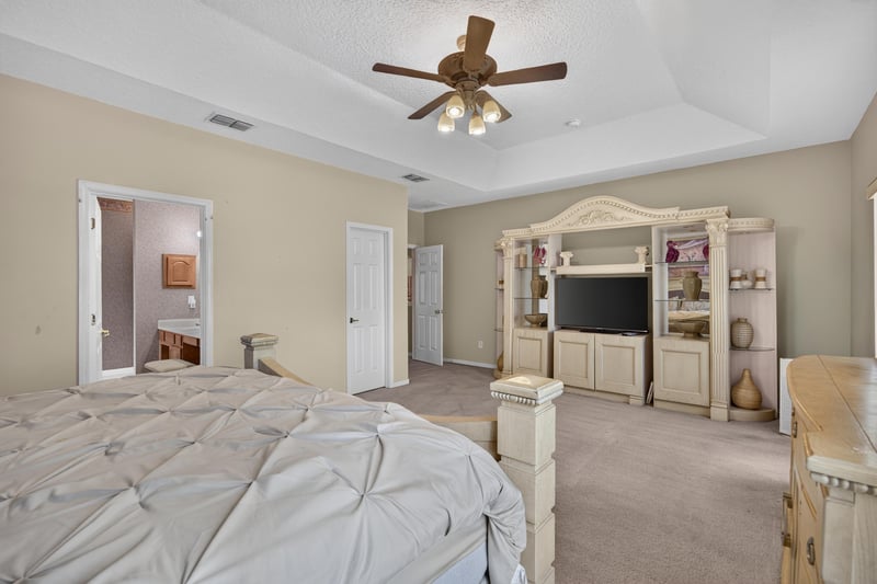 Bedroom with entertainment center at 2875 Pebblewood Ln, Orange Park, FL 32065