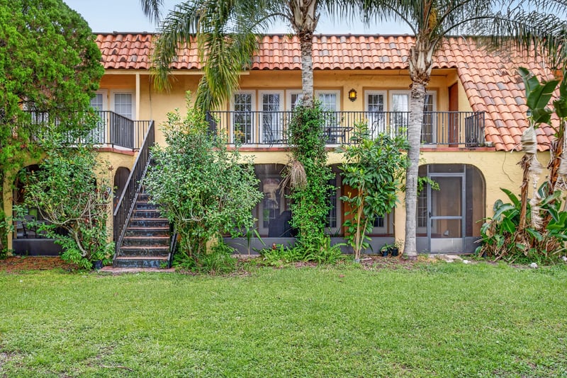 Rear exterior with stairs and greenery at 3866 Campenero Ct unit 6, Jacksonville, FL 32217