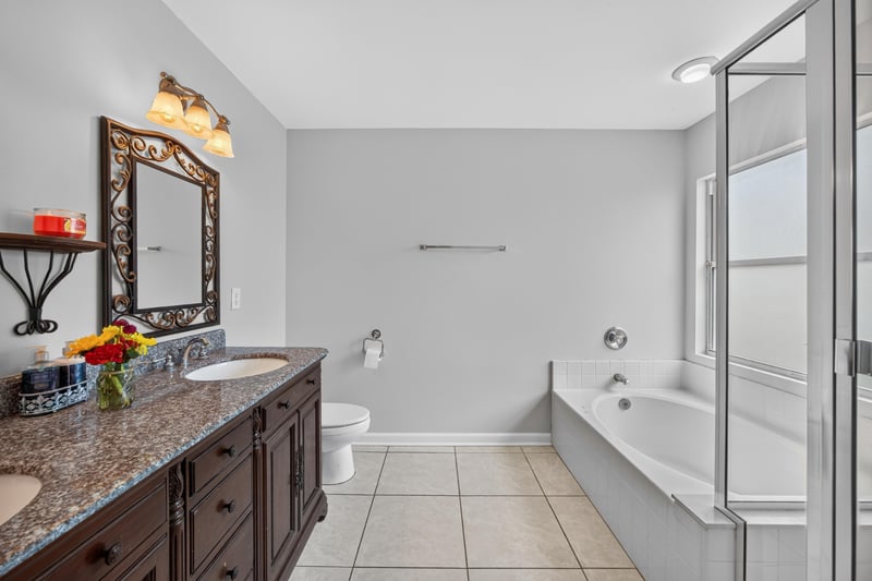 Bathroom vanity with granite counter at 456 Bay Point Way N, Jacksonville, FL 32259