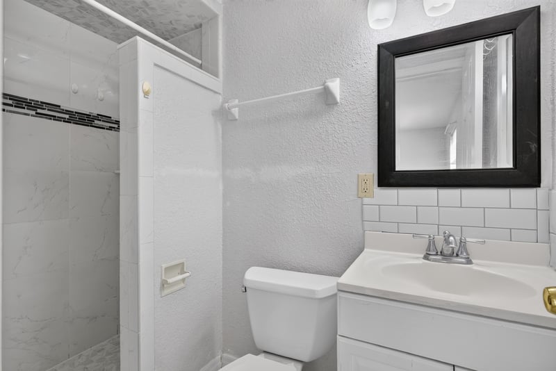 Bathroom with tiled shower stall at 442 Ameca Ave, Orange Park, FL 32073