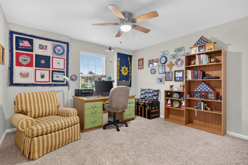 Bonus room with bookshelves and desk at 4319 Green River Pl, Middleburg, FL 32068