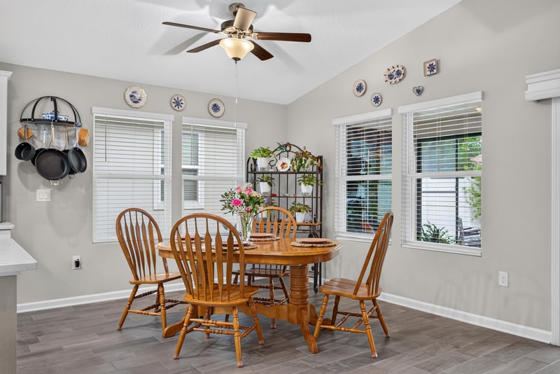 Dining nook with wood table and windows at 4319 Green River Pl, Middleburg, FL 32068