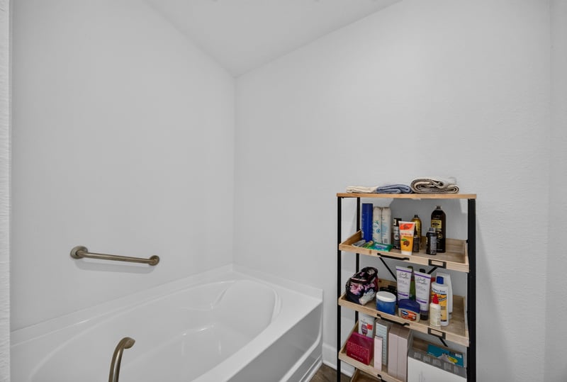 Bathroom with soaking tub and grab bar at 9846 Olivia St, Jacksonville, FL