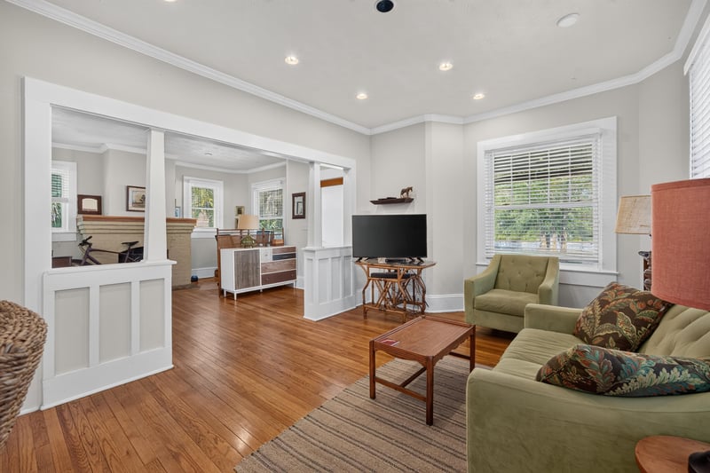 Open living and dining area with wainscoting at 1555 Belmonte Ave, Jacksonville, FL 32207