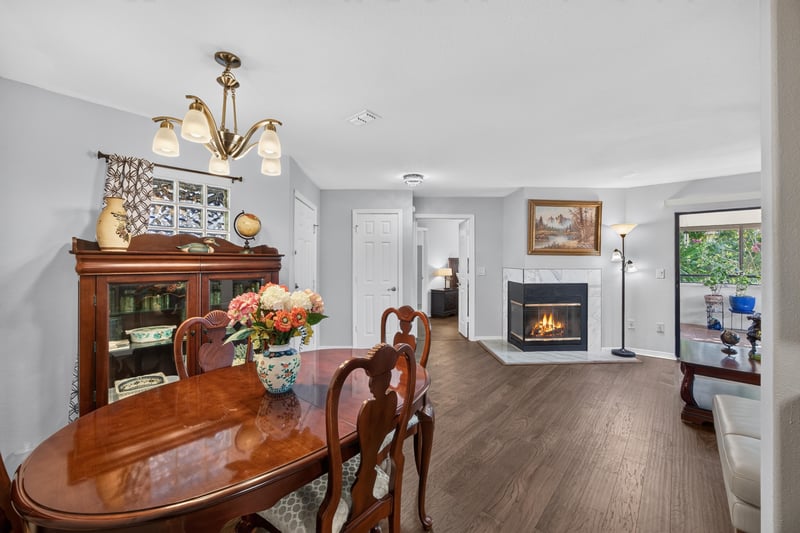 Dining room with fireplace and wood hutch at 10150 Belle Rive Blvd, Jacksonville, FL