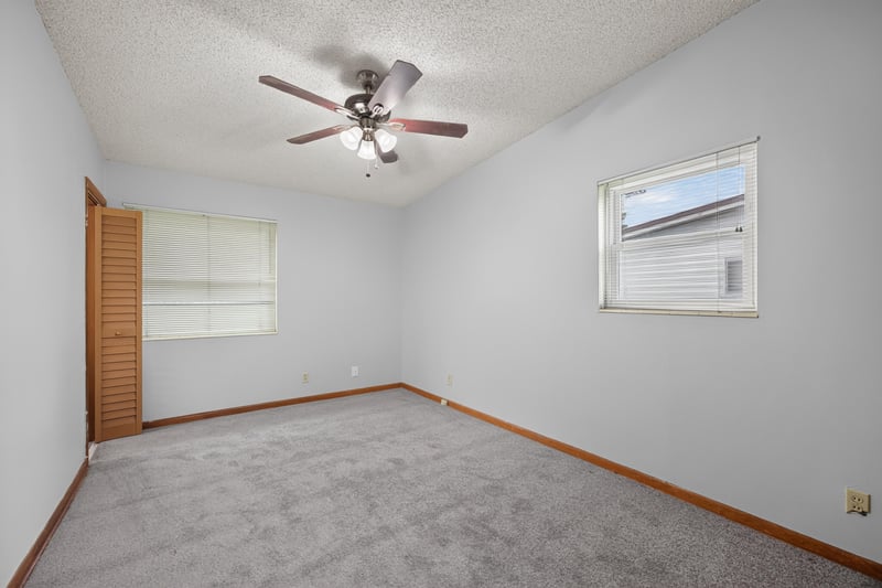 Carpeted bedroom with window at 11462 Elane Dr, Jacksonville, FL