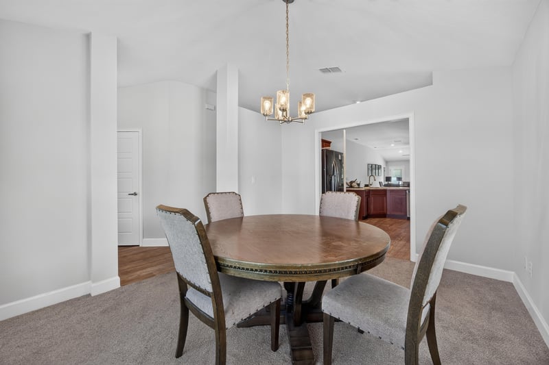 Dining area with view toward kitchen at 9846 Olivia St, Jacksonville, FL