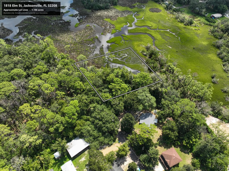 Aerial view of parcel boundary near rooftops and trees at 1818 Elm St, Jacksonville, FL 32208