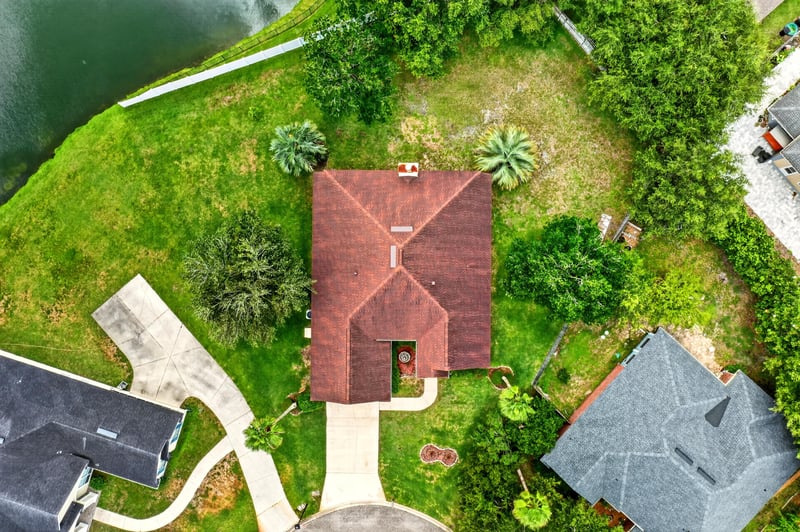 Top-down aerial view of the home's tile roof at 2480 Ridge Will Dr, Jacksonville, FL 32246