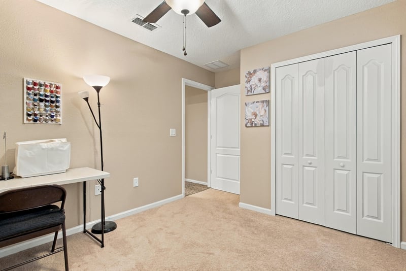Flex room with desk and closet doors at 10923 Black Diamond Ct, Jacksonville, FL