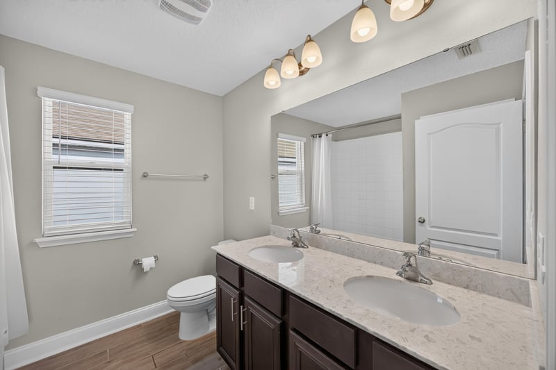 Bathroom with dark wood vanity at 331 Millerstone Dr, St. Augustine, FL 32092