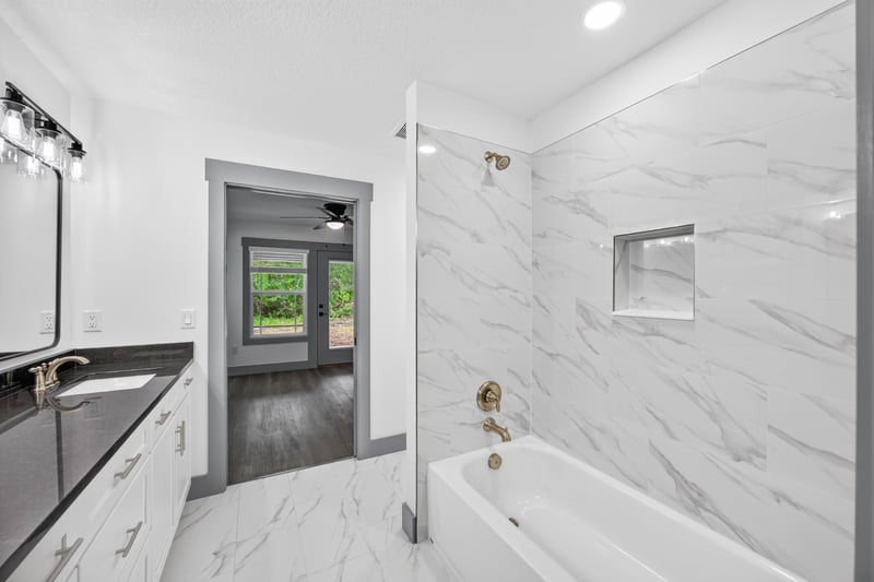 Bathroom shower with tile surround at 4800 Acacia St, Middleburg, FL 32068