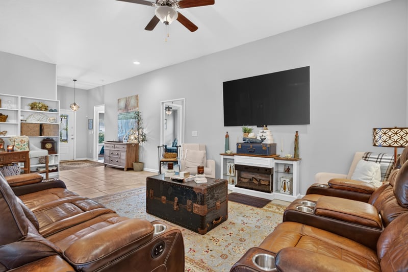 Living room with fireplace and area rug at 589 Seville Pkwy, St. Augustine, FL