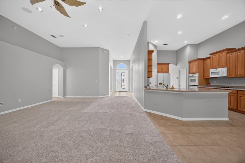 Kitchen with breakfast bar and wood cabinets at 635 Wakeview Dr, Orange Park, FL 32065