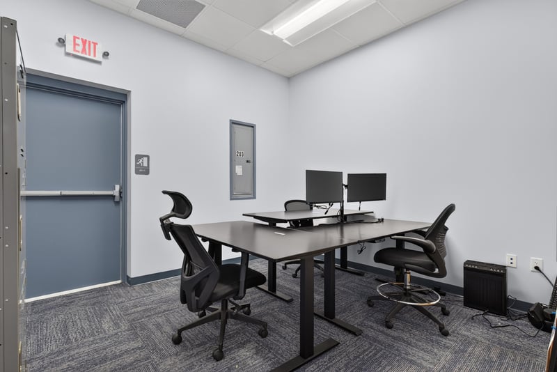 Staged office with standing desk and dual monitors at 7240 Golden Wings Rd building 100, Jacksonville, FL 32244