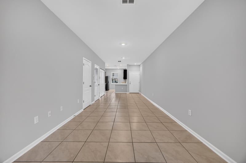 Hallway view toward kitchen with tile floor at 2837 Black Buck Cir, Jacksonville, FL 32225