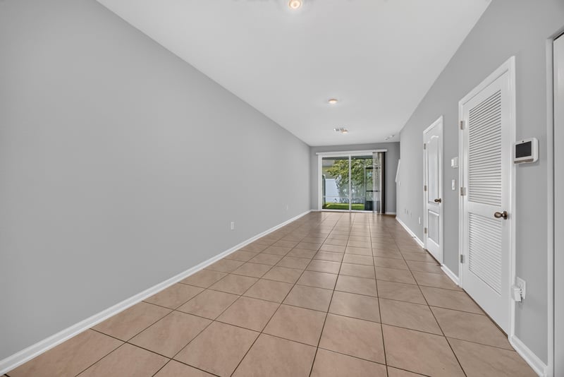 Hallway view toward sliding glass back door at 2837 Black Buck Cir, Jacksonville, FL 32225