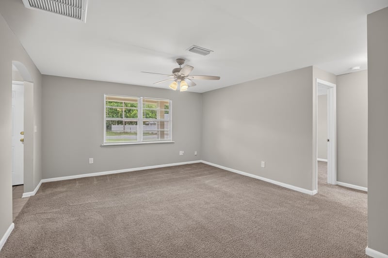 Living room corner with window and carpet at 1143 Tumbleweed Dr, Orange Park, FL 32065