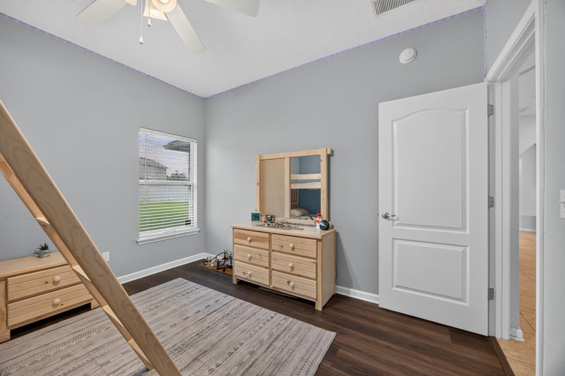 Bedroom with wood dresser and loft bed frame at 538 Porta Rosa Circle, St. Augustine, FL 32092