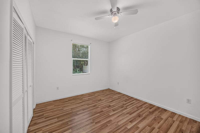 Bedroom with window and ceiling fan at 1012 Fruit Cove Rd, Jacksonville, FL 32259