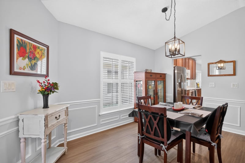 Dining room with wood table and hutch at 11225 Water Spring Cir, Jacksonville, FL 32256