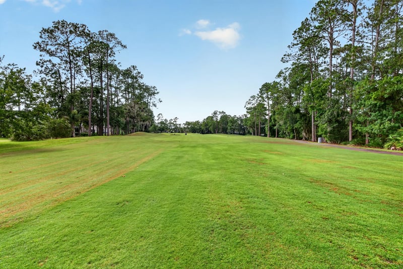 Open backyard lawn at 2304 Spring Hill Ct, Orange Park, FL