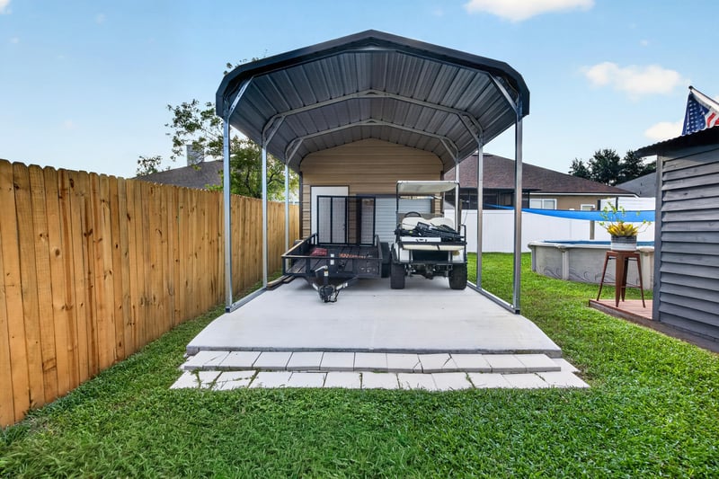 Metal carport sheltering a golf cart at 3112 Silverado Cir, Green Cove Springs, FL 32043