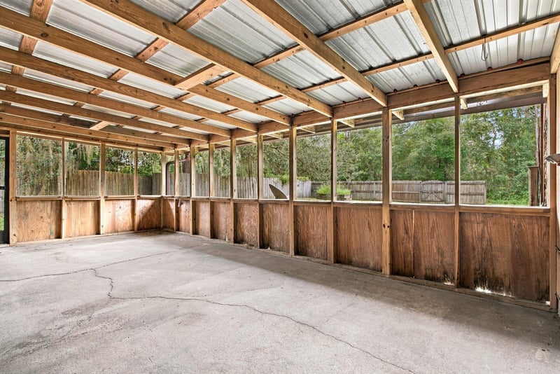 Screened back porch with exposed wood beams at 2915 Trenton Ct, Orange Park, FL