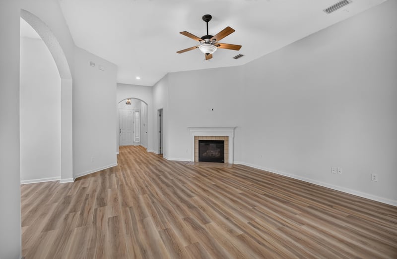 Living room with fireplace and vaulted ceiling at 3101 E Banister Rd, St. Augustine, FL 32092