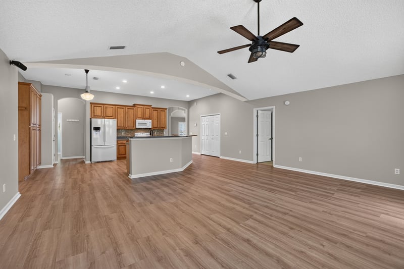 Open kitchen and living area at 1955 GUARDED Way, Fleming Island, FL 32003
