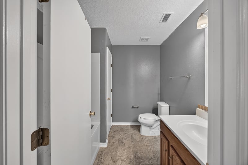 Bathroom with vanity and toilet at 2282 Justin Lake Dr, Jacksonville, FL