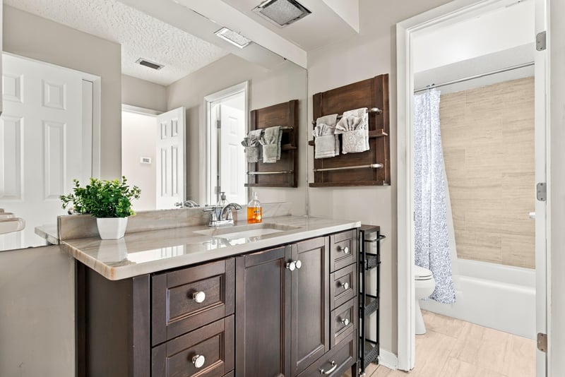 Bathroom vanity interior view with dark cabinetry, photographed by Megapixeler on Crosby Ln, Orange Park