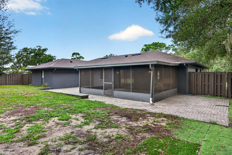 Rear exterior with screened porch at 551 Deltona Blvd, St. Augustine, FL 32086