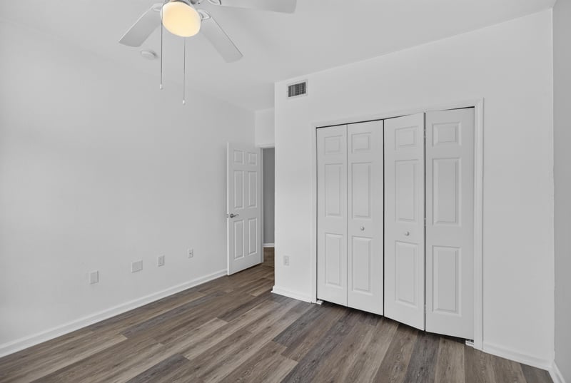Empty room with closet doors and ceiling fan at 10075 Gate Pkwy unit 1905, Jacksonville, FL 32246