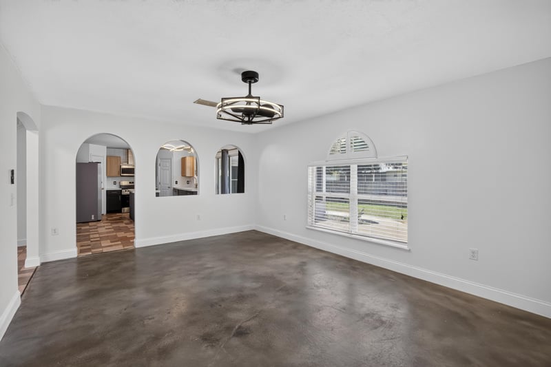 Empty room with arched doorways and windows at 3428 Glenn Hollow Ct, Jacksonville, FL 32226