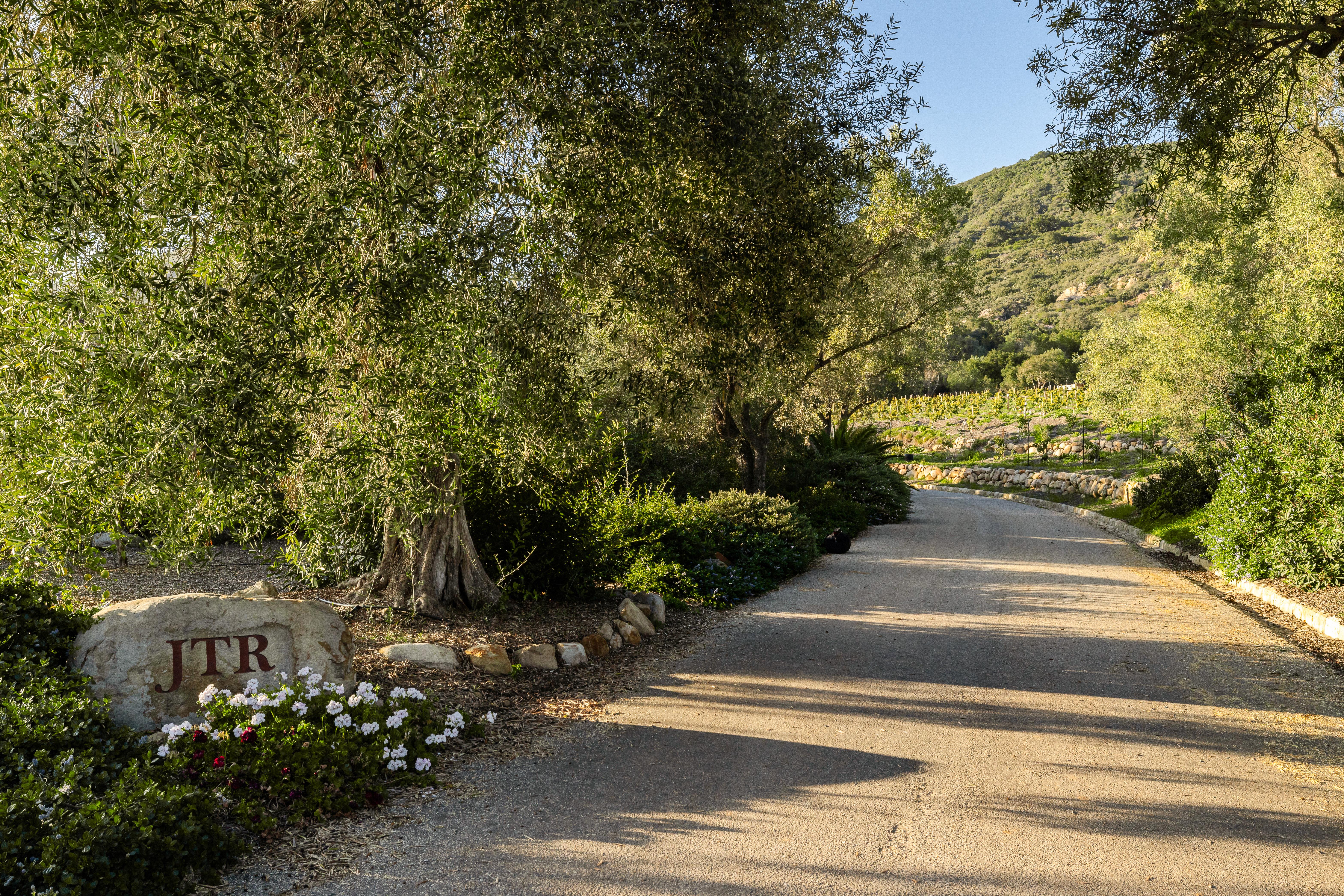 Real estate drone photography showcasing the Montecito foothills and Santa Ynez Mountain backdrop visible from 1915 Monte Alegre Dr, Carpinteria — a rare Southern California estate of singular proportion and presence. Our team captured editorial photography, aerial drone photography via Inspire 3 Cinema Drone, a cinematic property video, a true vertical social media reel, and twilight photography from midday through twilight.