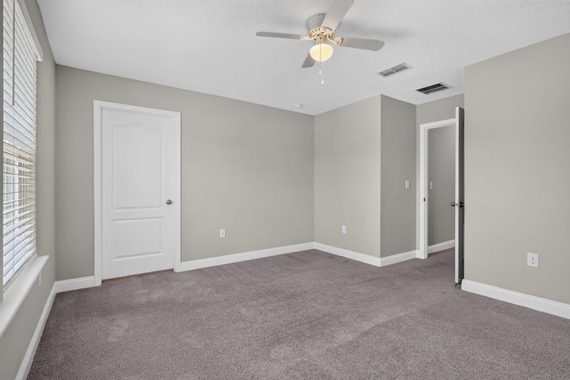 Bedroom with ceiling fan and carpet at 2580 Cold Stream Ln, Green Cove Springs, FL 32043