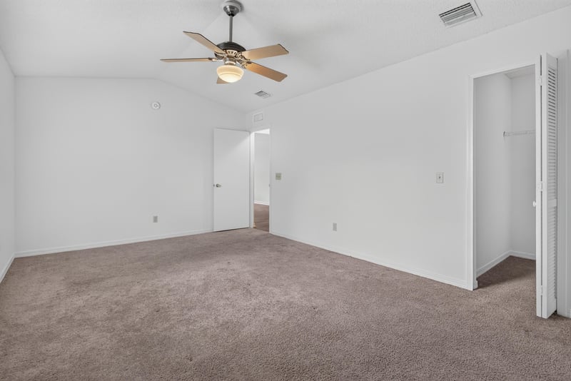 Bedroom corner with closet door at 1445 Classic Oak Rd W, Jacksonville, FL